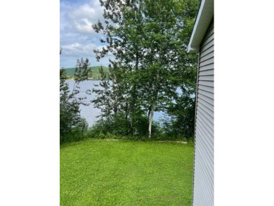 Experience the charm of lakeside living with this incredible