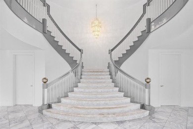 Positioned within the exclusive, guard-gated community of Bay