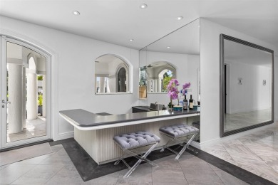 Positioned within the exclusive, guard-gated community of Bay