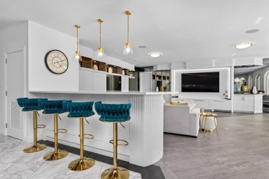 Positioned within the exclusive, guard-gated community of Bay