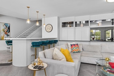 Positioned within the exclusive, guard-gated community of Bay