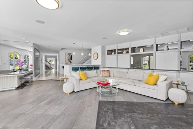 Positioned within the exclusive, guard-gated community of Bay