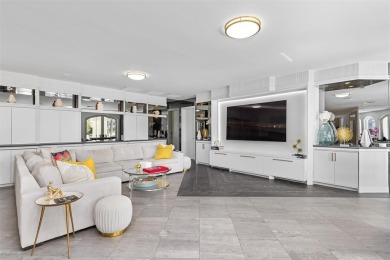 Positioned within the exclusive, guard-gated community of Bay