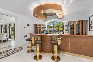 Positioned within the exclusive, guard-gated community of Bay