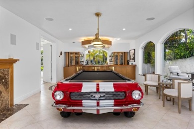 Positioned within the exclusive, guard-gated community of Bay