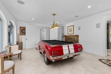 Positioned within the exclusive, guard-gated community of Bay