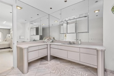 Positioned within the exclusive, guard-gated community of Bay