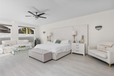 Positioned within the exclusive, guard-gated community of Bay