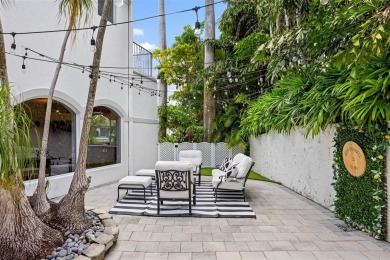 Positioned within the exclusive, guard-gated community of Bay