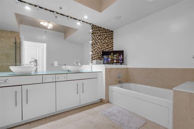 This stunning 1-bedroom, 1.5-bath condo with unobstructed South