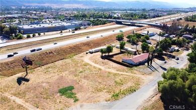 This flat 3.10 acres runs adjacent to the North bound 15 FRWY