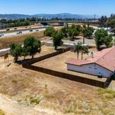 This flat 3.10 acres runs adjacent to the North bound 15 FRWY