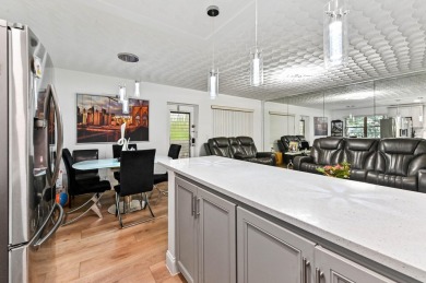 Discover exceptional lakeside living in this rare, rentable