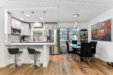 Discover exceptional lakeside living in this rare, rentable