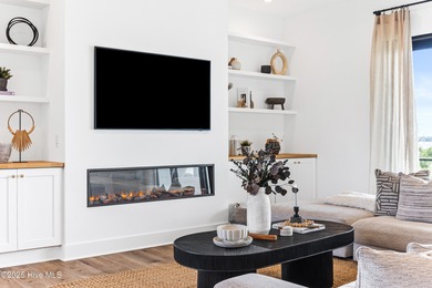 Imagine gliding home along River Road at golden hour, the Cape