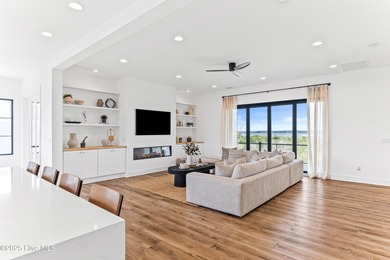 Imagine gliding home along River Road at golden hour, the Cape