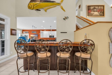 Marsh views from this 2 story, Raised Beach home surrounded by