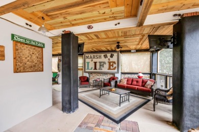 Marsh views from this 2 story, Raised Beach home surrounded by