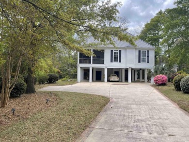 Marsh views from this 2 story, Raised Beach home surrounded by