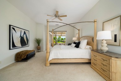 The beautifully relandscaped front yard with faux grass, exotic