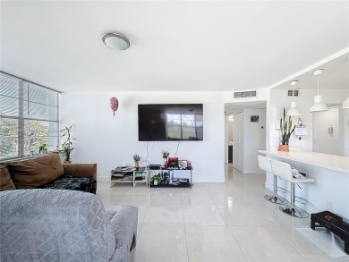 Welcome to this beautifully maintained third-floor condo in the