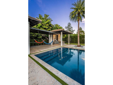 Upon entry, a breathtaking resort-style pool with Bali-inspired