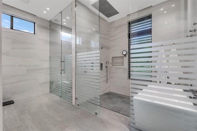 Upon entry, a breathtaking resort-style pool with Bali-inspired