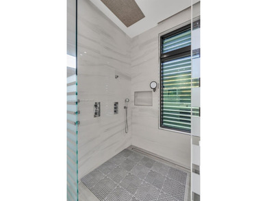 Upon entry, a breathtaking resort-style pool with Bali-inspired