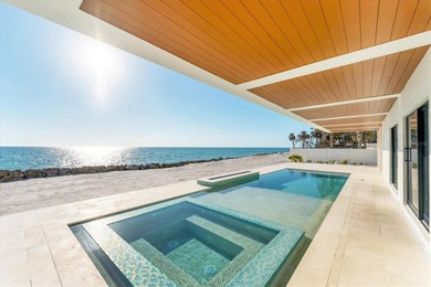 WELCOME TO ONE OF THE FEW BRAND-NEW GULF FRONT HOMES FOR SALE ON