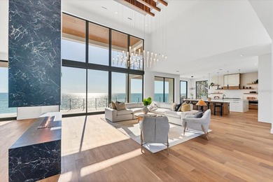 WELCOME TO ONE OF THE FEW BRAND-NEW GULF FRONT HOMES FOR SALE ON