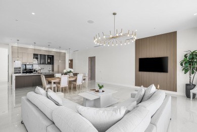 This exceptional just-completed penthouse at Aria offers a rare