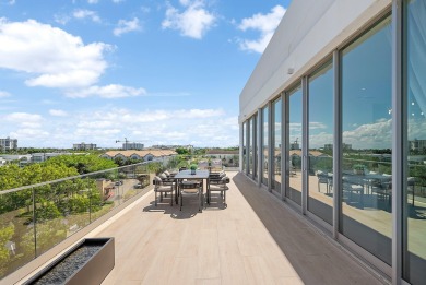 This exceptional just-completed penthouse at Aria offers a rare