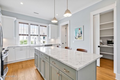 Welcome to an exquisite PBC designed townhome nestled in the