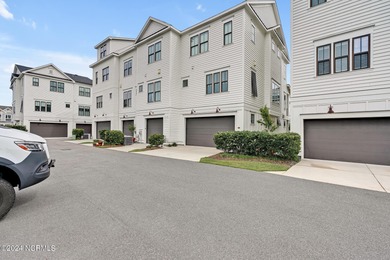 Welcome to an exquisite PBC designed townhome nestled in the