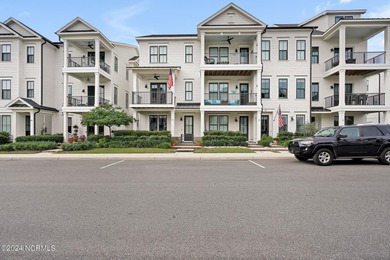 Welcome to an exquisite PBC designed townhome nestled in the