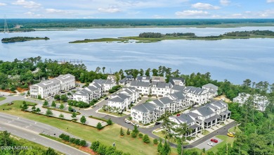 Welcome to an exquisite PBC designed townhome nestled in the