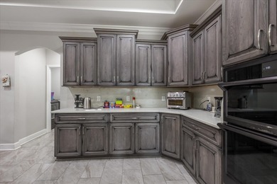 Experience exceptional craftsmanship in this custom-built home