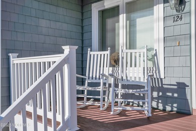 Enjoy water views from every window in this beautifully crafted