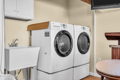 Enjoy water views from every window in this beautifully crafted