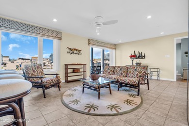 Enjoy water views from every window in this beautifully crafted