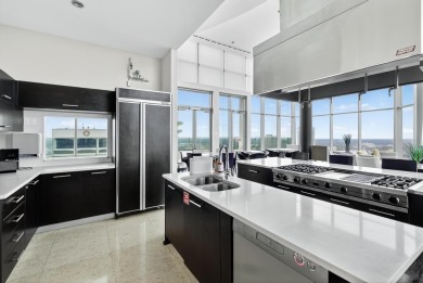 Luxury Riverfront Condominium with Stunning Views & High-End