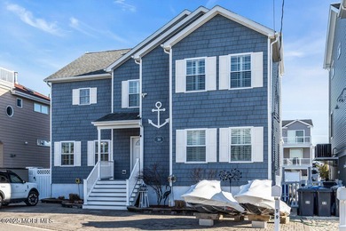 Welcome to your dream coastal retreat, just a few houses from