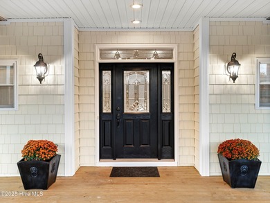 Welcome to this exquisite custom-built soundfront home in