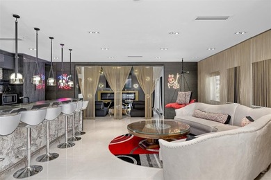 Indulge in luxurious coastal living at this elegantly-remodeled