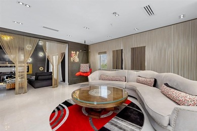 Indulge in luxurious coastal living at this elegantly-remodeled