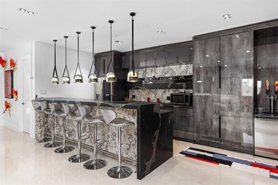 Indulge in luxurious coastal living at this elegantly-remodeled