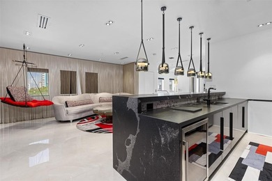 Indulge in luxurious coastal living at this elegantly-remodeled