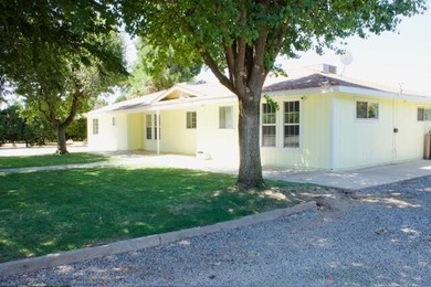 Versatile 4 bedroom home on 4.4 acres with mature producing Cara