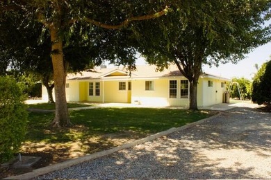 Versatile 4 bedroom home on 4.4 acres with mature producing Cara