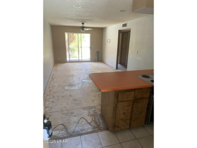 OWNER WILL CARRY. THIS 2BR.CONDO HAS A 1 CAR GARAGE. SOLD AS-IS